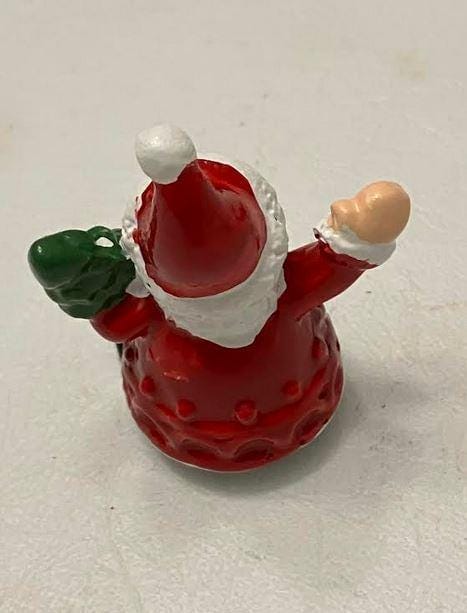 Miniature Santa Figurine Holding Christmas Tree