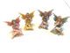 Set of 4 Sitting Shimmery  Fairies Holding a Flower